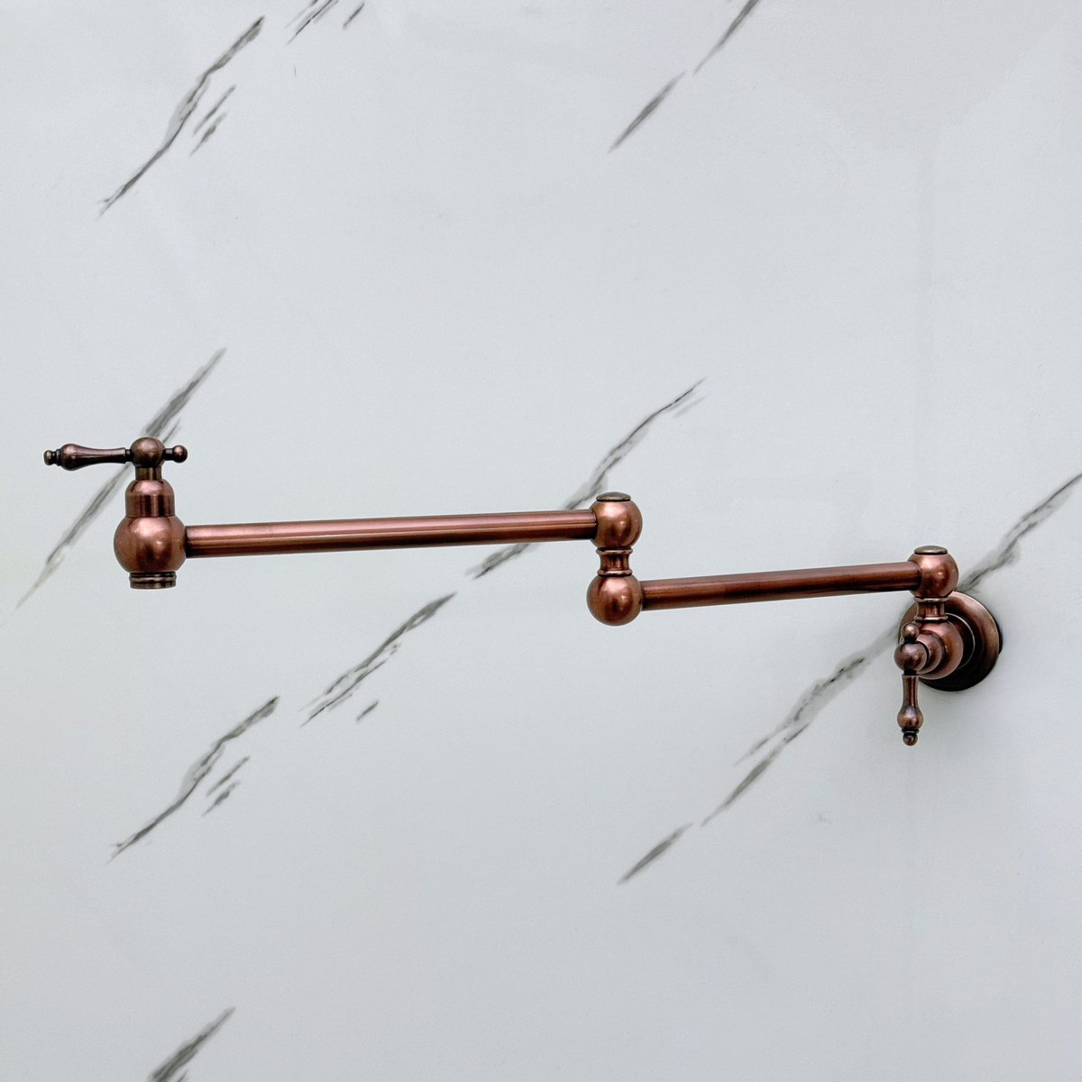 Lever handle detail on antique copper pot filler