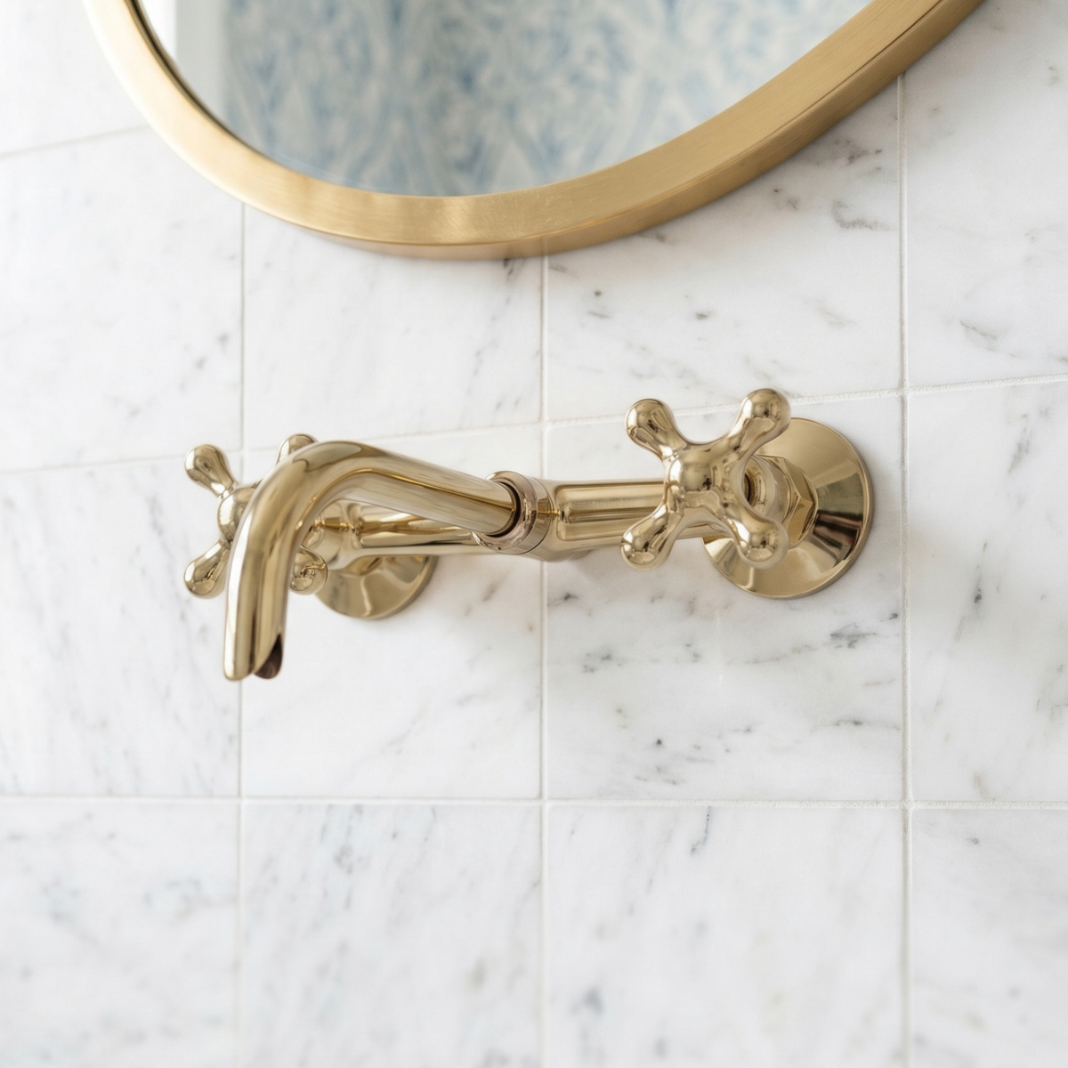 10" Curved unlacquered brass wall faucet, 3.5" drop with cross handles