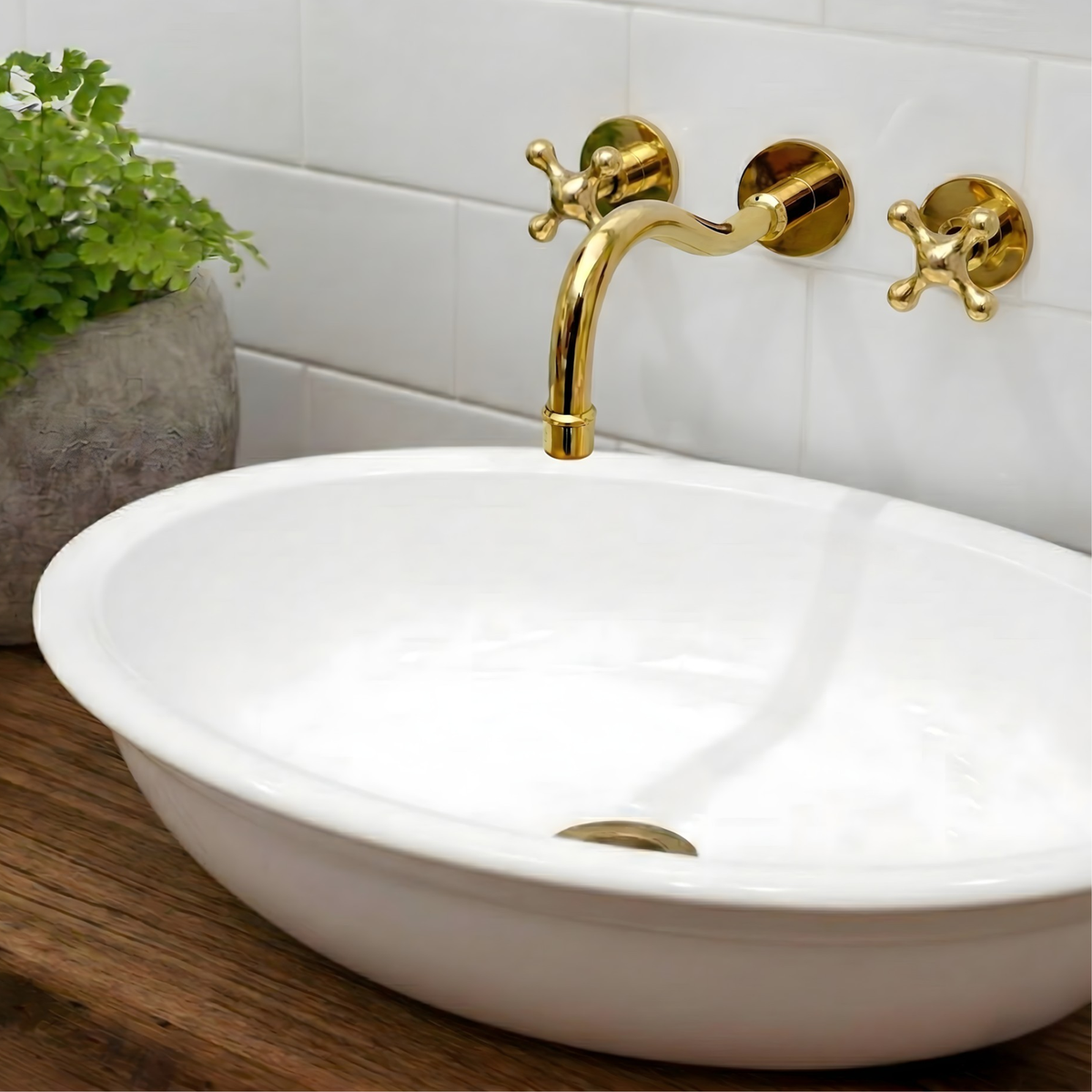 8" Curved unlacquered brass wall faucet, 2" drop with cross handles