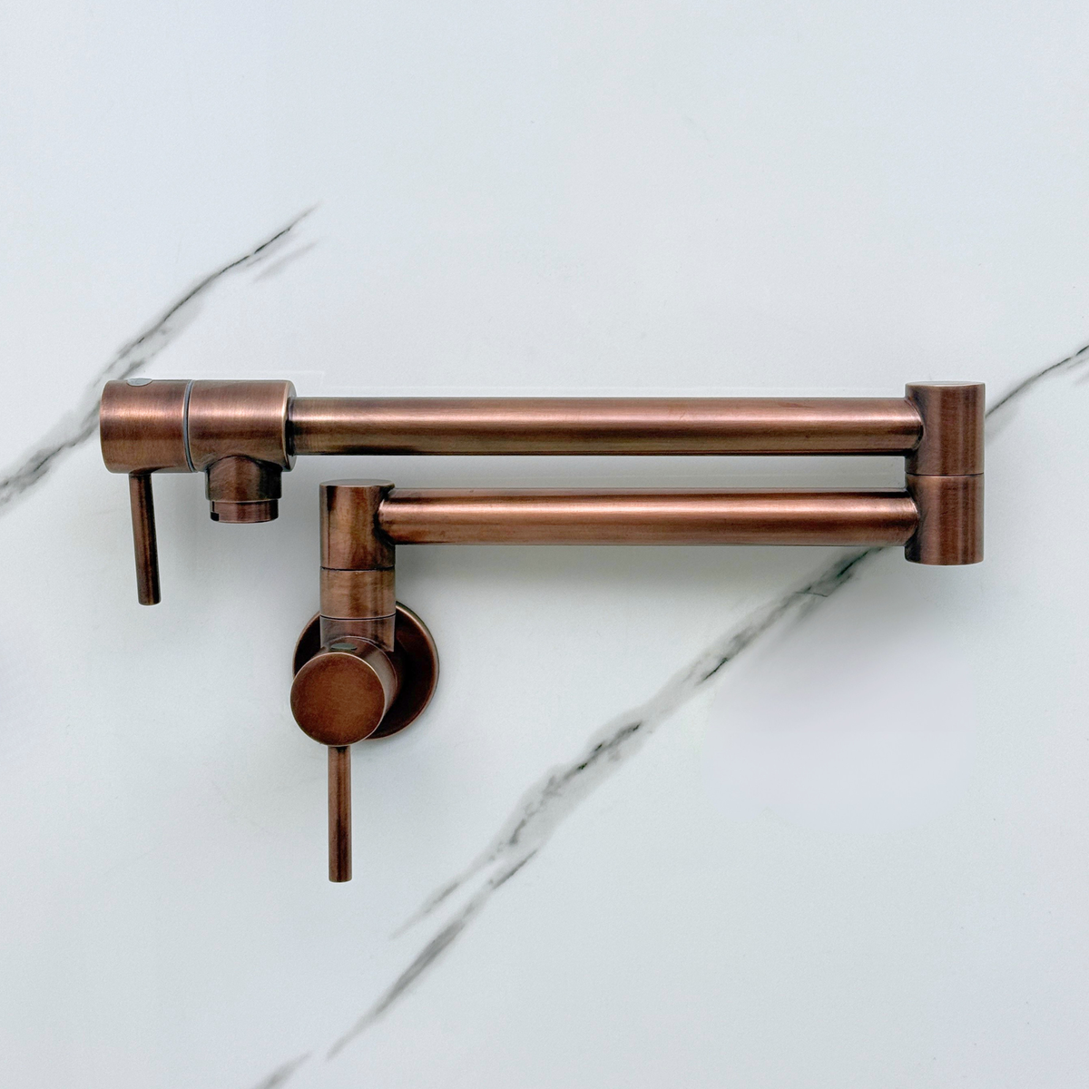 Antique copper pot filler in a kitchen setting