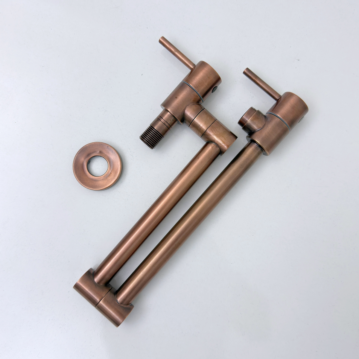 Wall connection detail on antique copper pot filler
