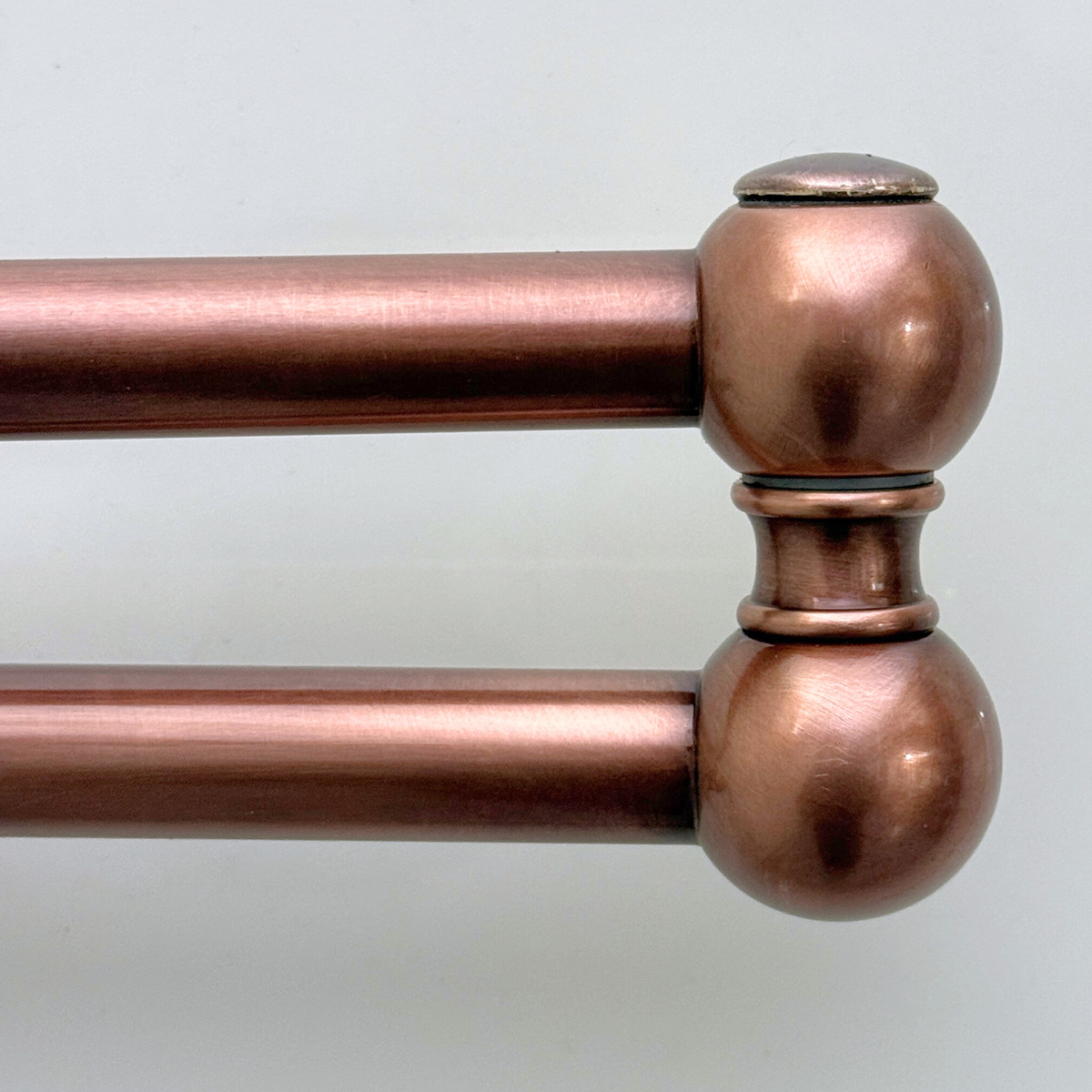 Antique copper finish detail on lever-handle pot filler
