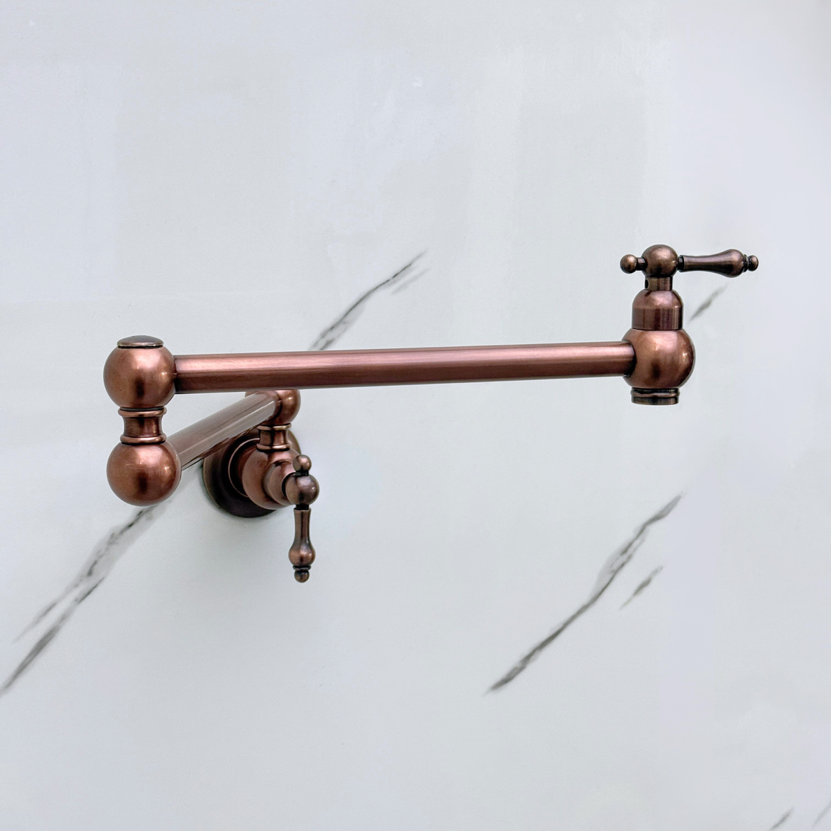 Antique copper lever-handle pot filler in a kitchen setting