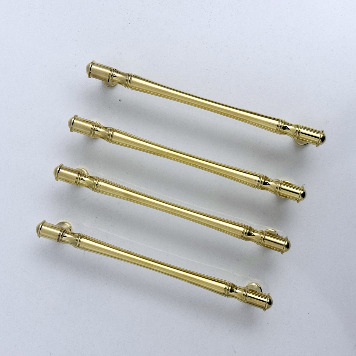 Golden brass cabinet handles with elegant ridged design for luxury home decor