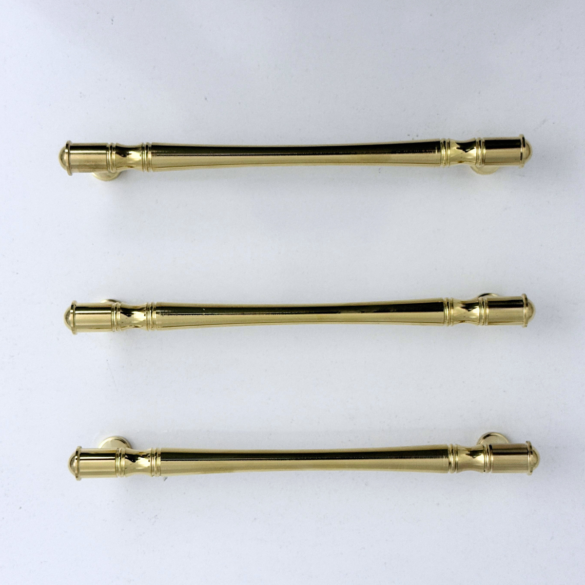 Golden brass cabinet handles with elegant detailing for luxury home décor