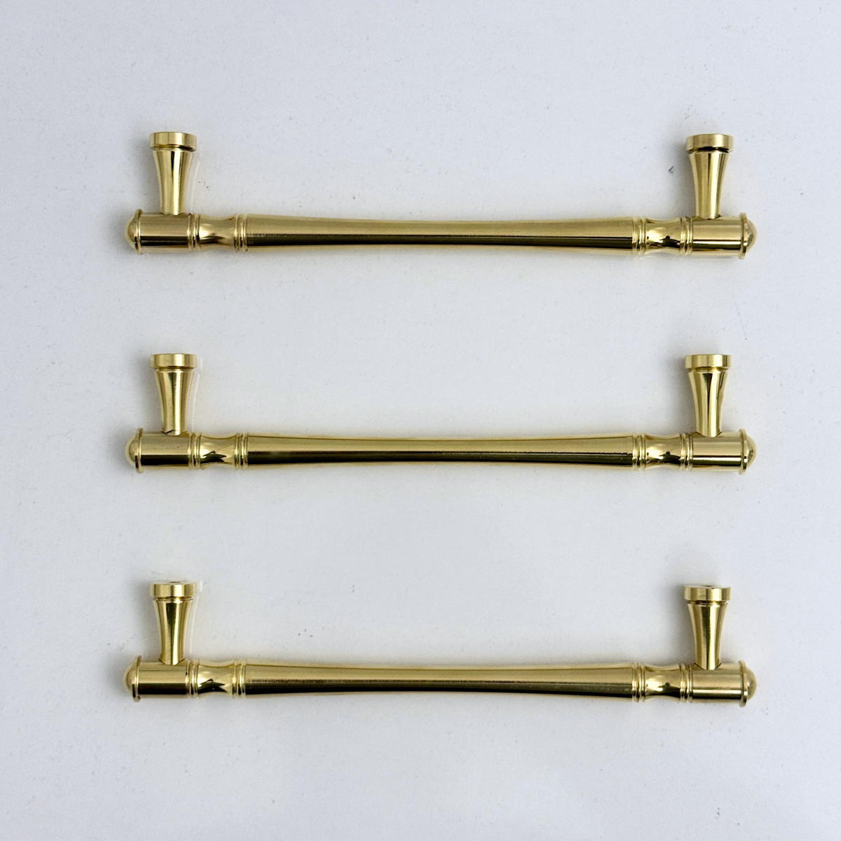 Golden brass cabinet handles with elegant design for luxury home décor