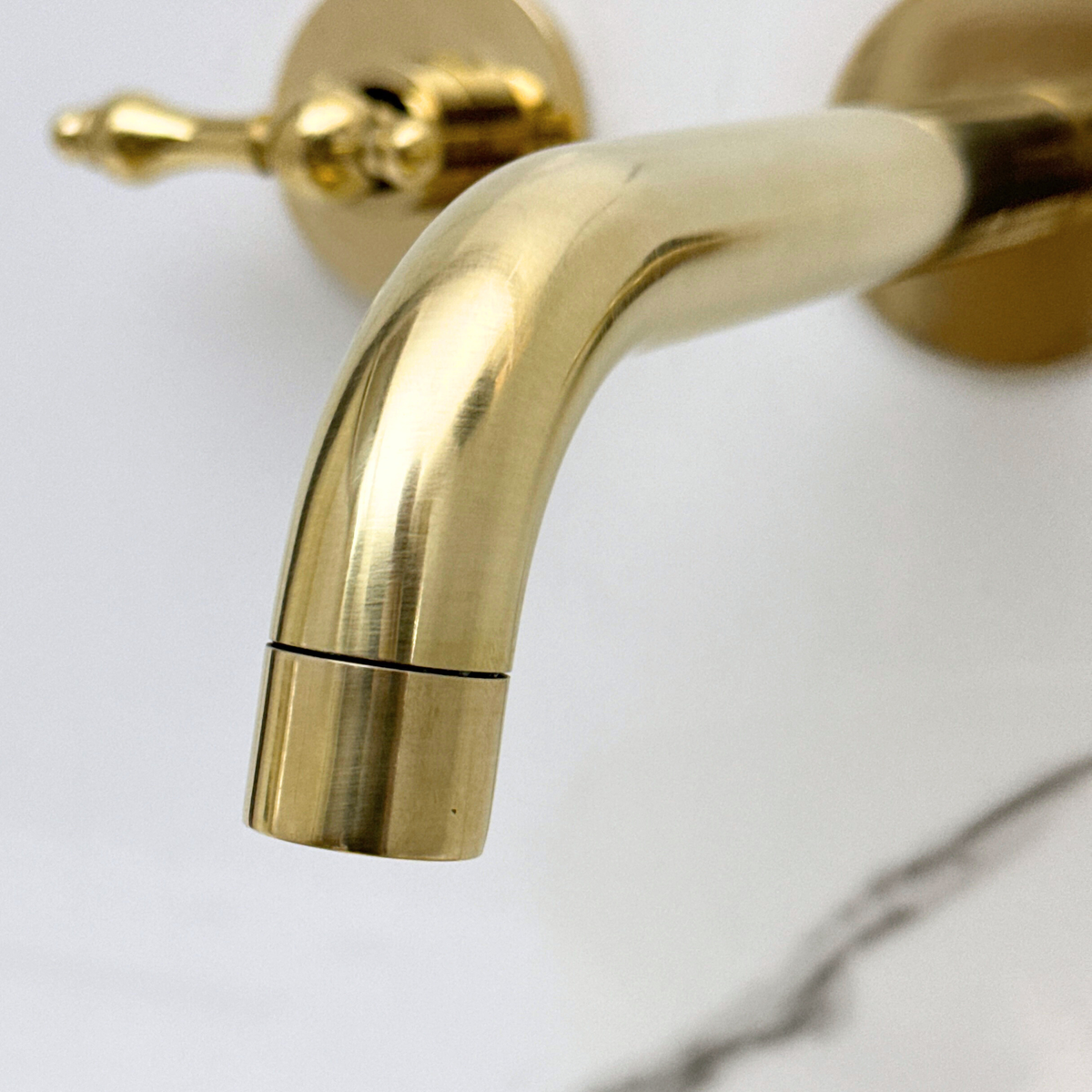 8" Curved unlacquered brass wall faucet, 2.5" drop with lever handles – alternate view 6